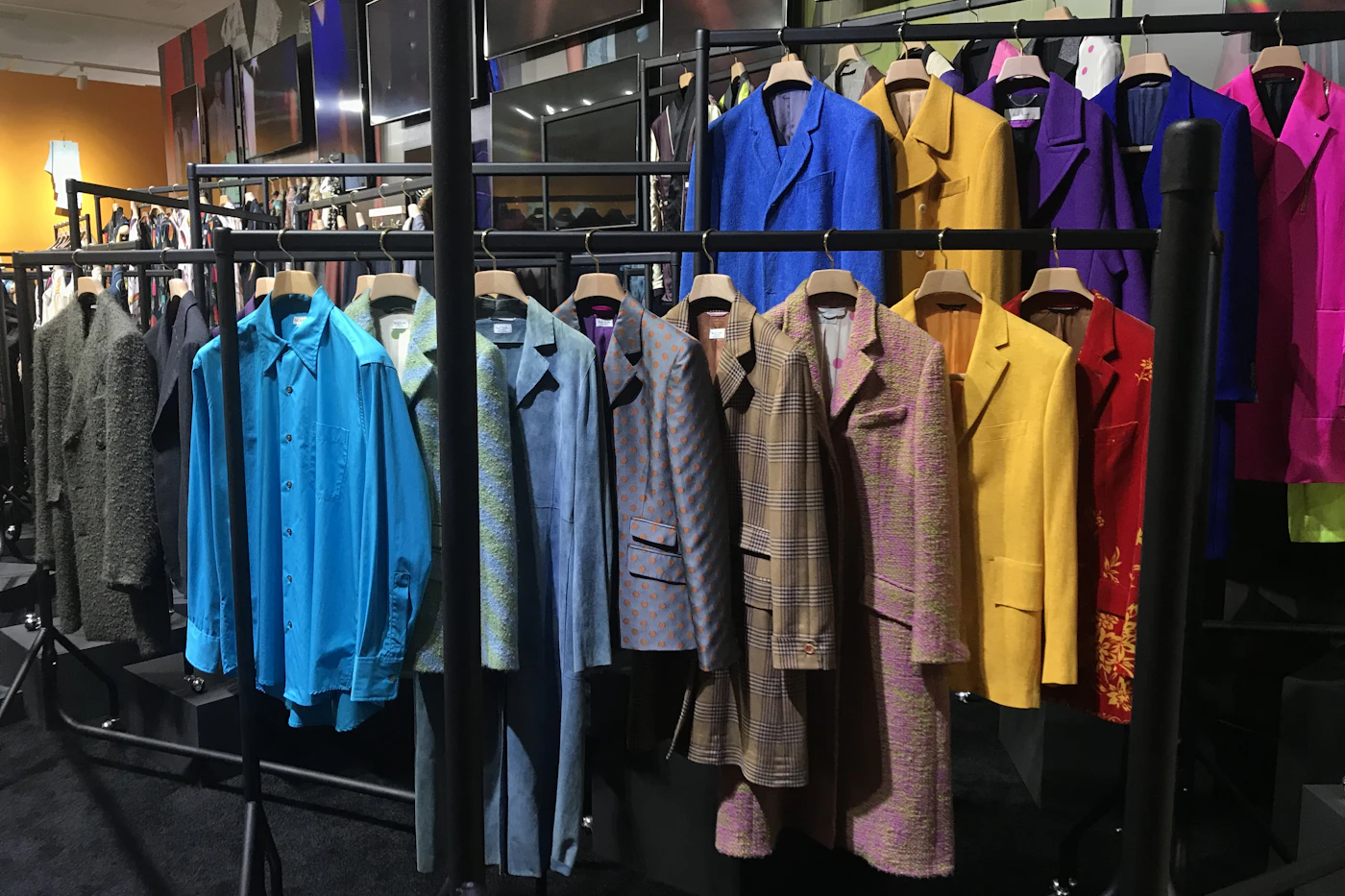Colorful fashion garments on a retail display rack