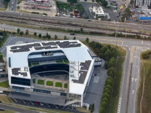 Aerial view of the Porsche Experience Center Atlanta building and surrounding roads, photographed in June 2024